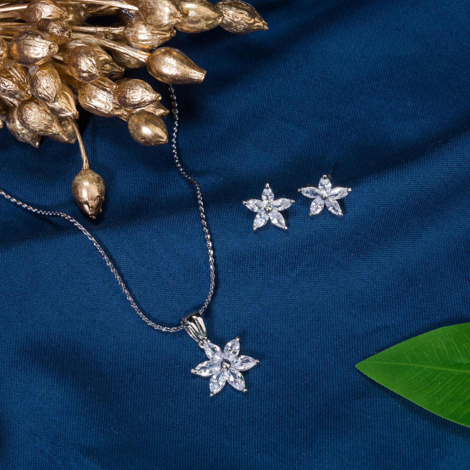 "Star-shaped zircon pendant set for neck and ear, ideal for office wear, adding a modern touch."