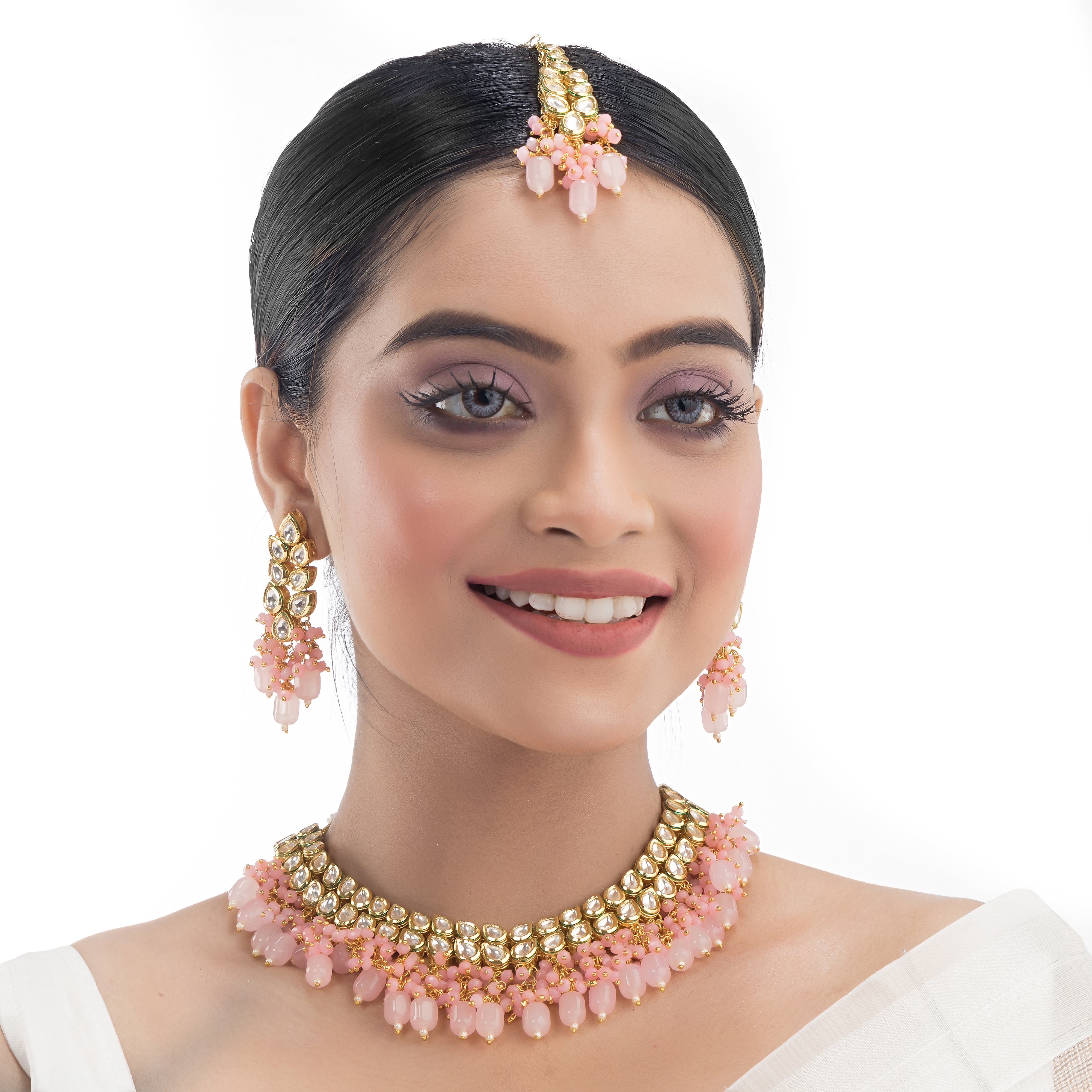 "Zircon stud earrings in silver offer intricate detailing and radiant sparkle for a traditional, elegant party wear look."