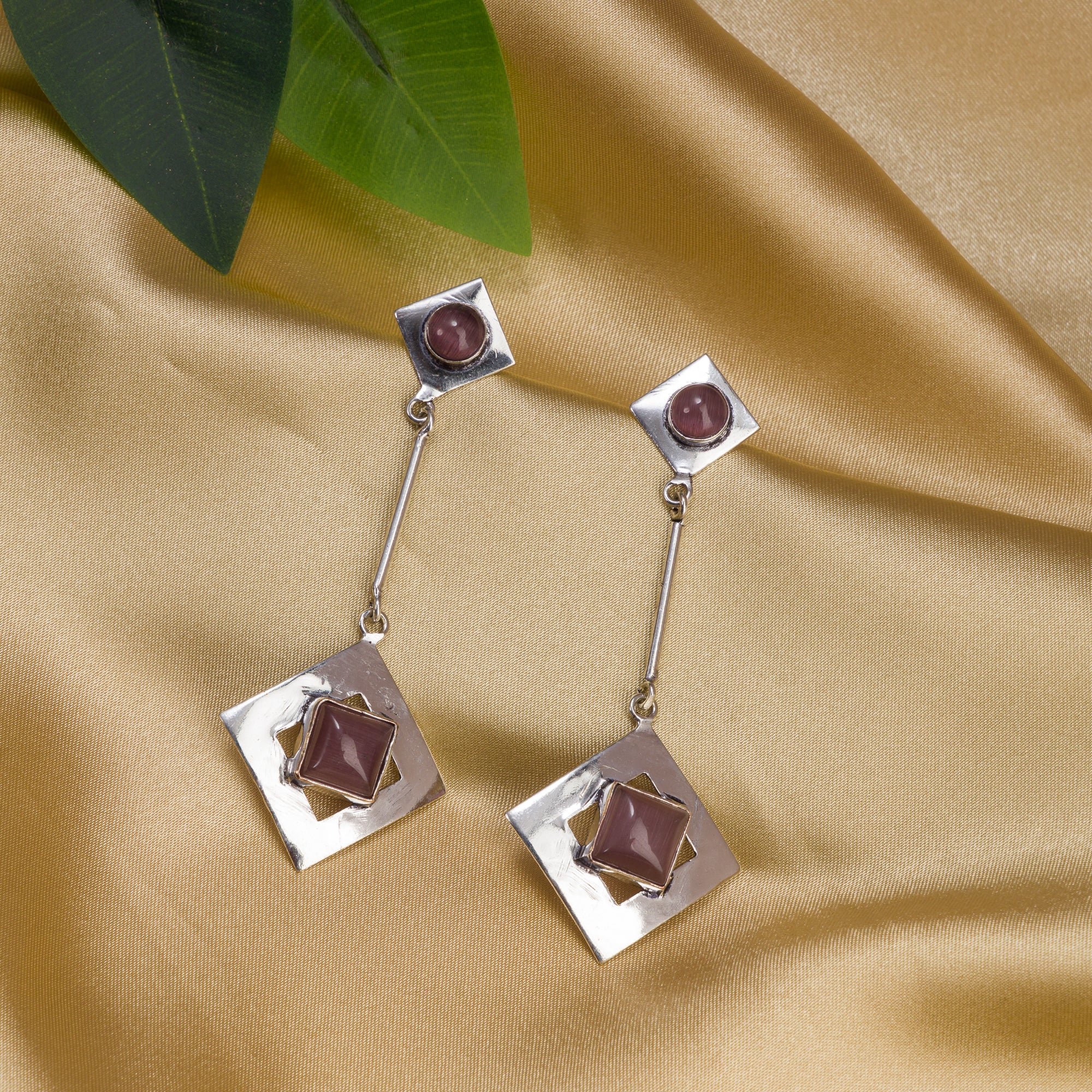 "Trendy oxidized metal dangler earrings add a sleek, modern edge to any outfit."