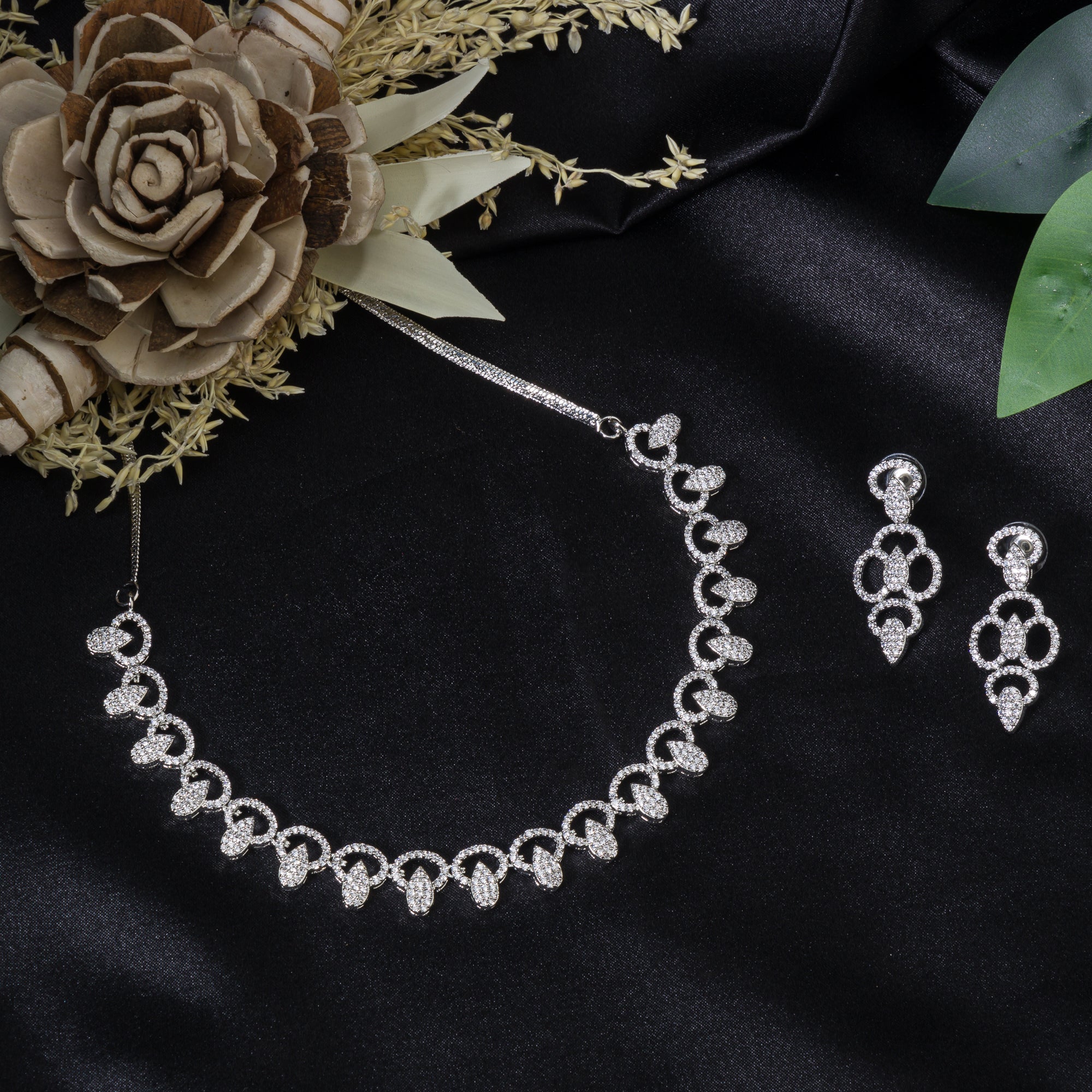 "Zircon necklace with large stone drop adds dramatic sparkle and elegance."