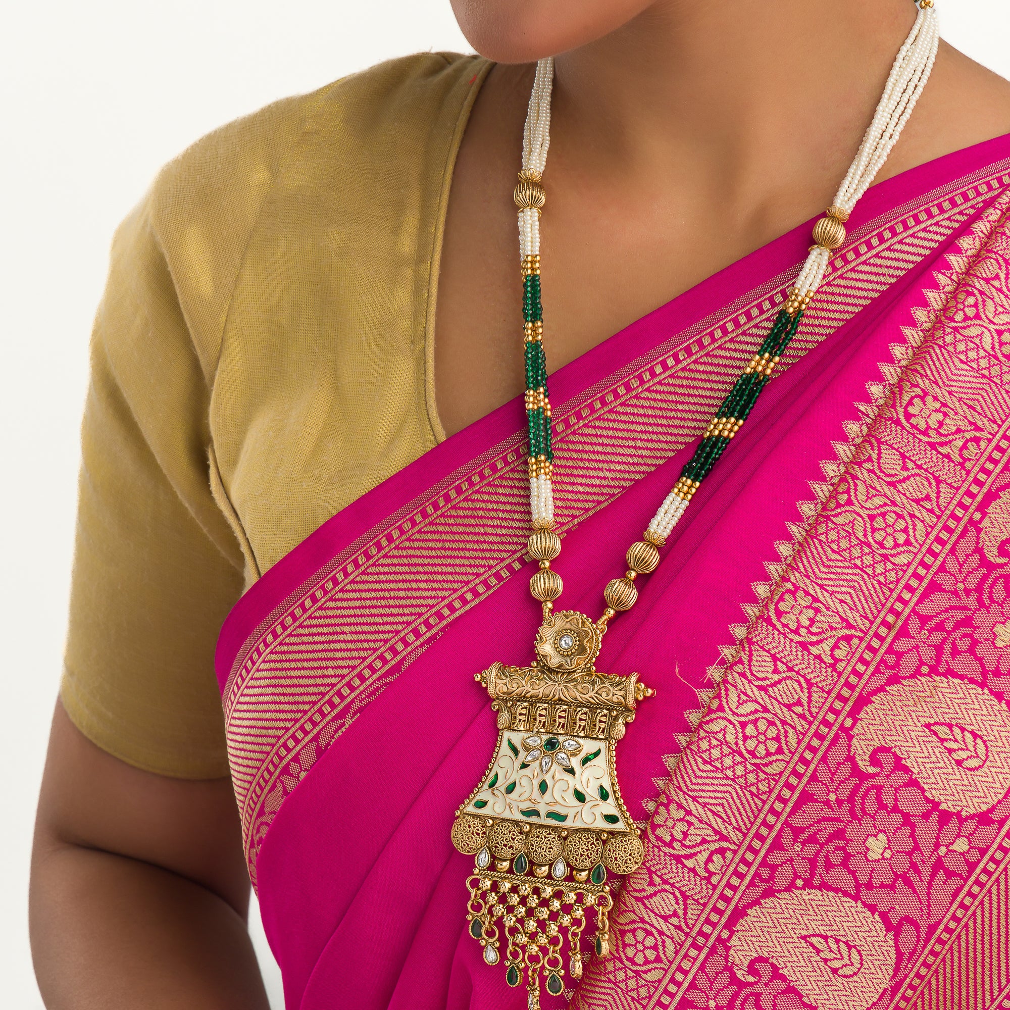 Long temple necklace with maroon pearls radiates classic festival opulence.