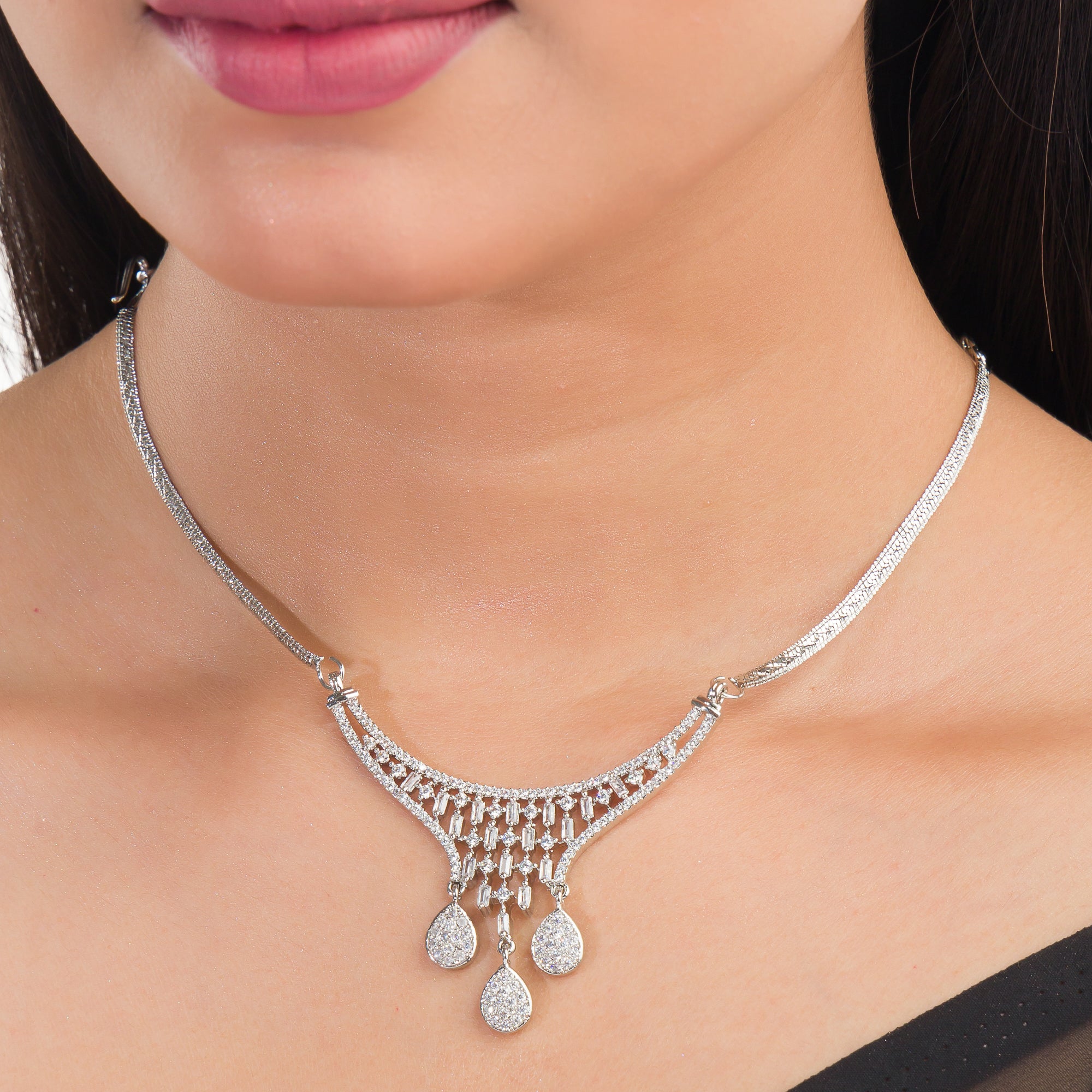 White zircon pendant and earrings set, perfect for festive elegance and timeless style.
