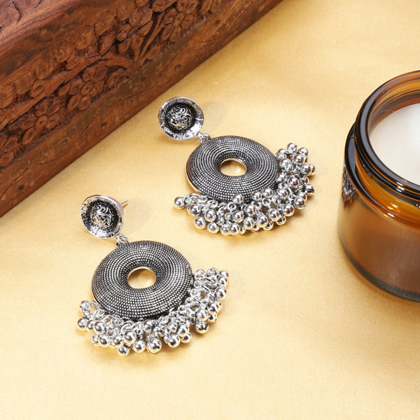 "Elegant oxidized hoops with a vintage finish, adding timeless sophistication to any outfit."
