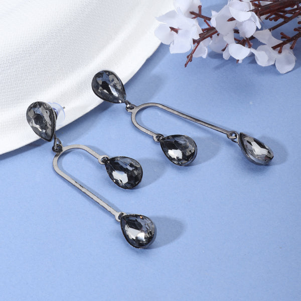 "Stylish oxidized danglers studded with black stones, offering a bold and sophisticated look."