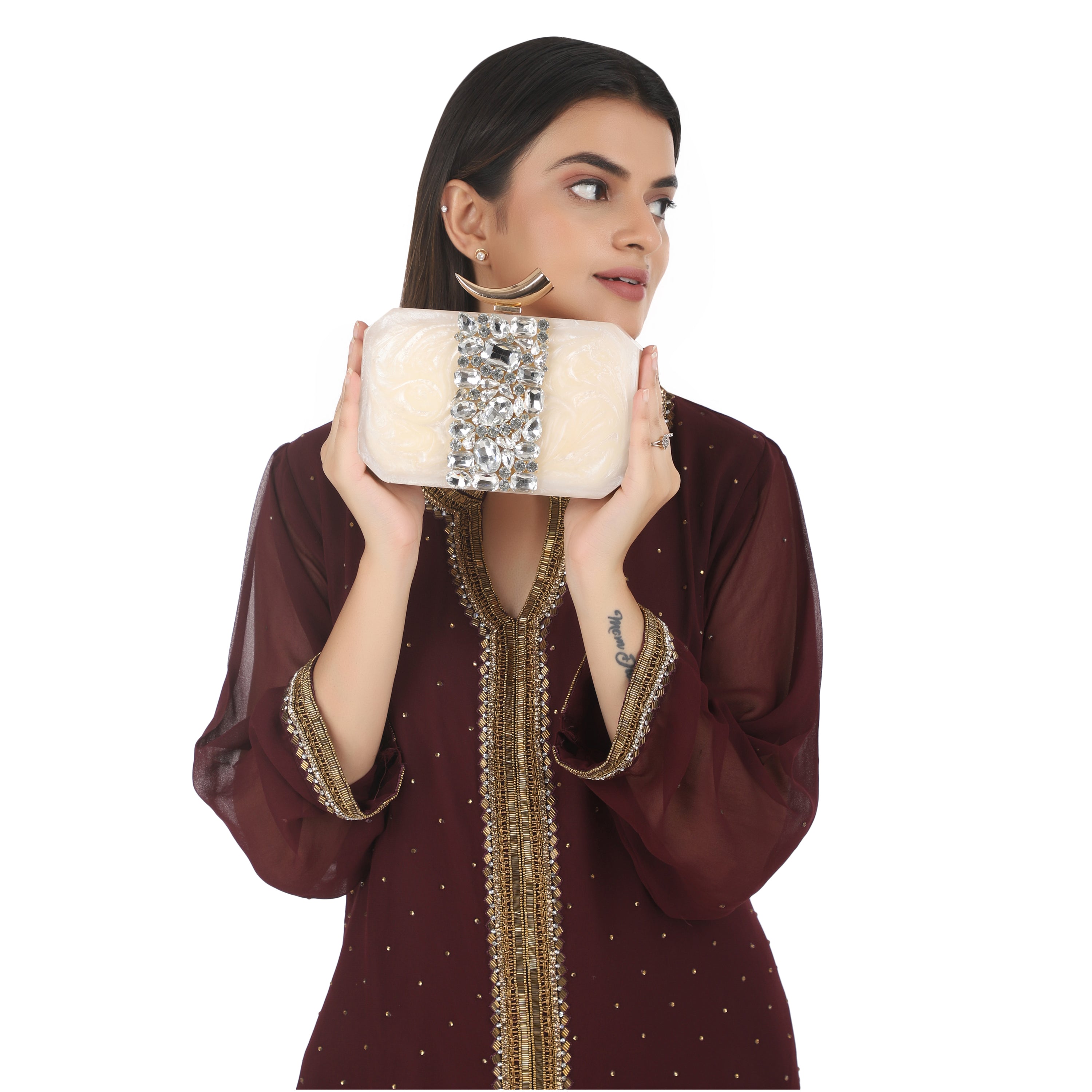 Salmon resin clutch with stone embellishments, soft lining, and extra pocket for practical storage.