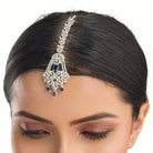 Blue zircon maang tika in silver, ideal for party wear, offering a striking touch of vibrant elegance.
