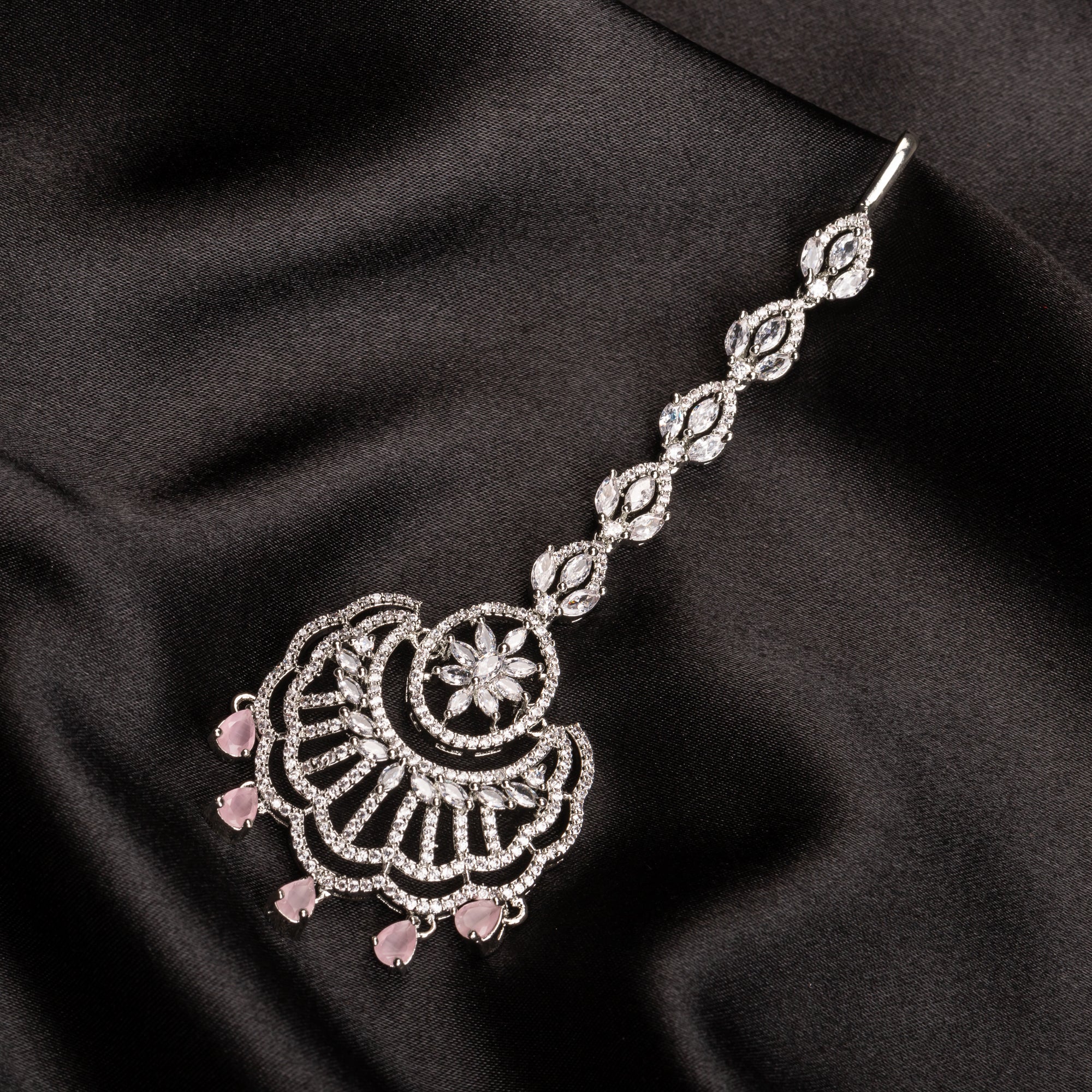 Pink zircon maang tika in silver, perfect for party wear, adding a soft, elegant pop of color to your look
