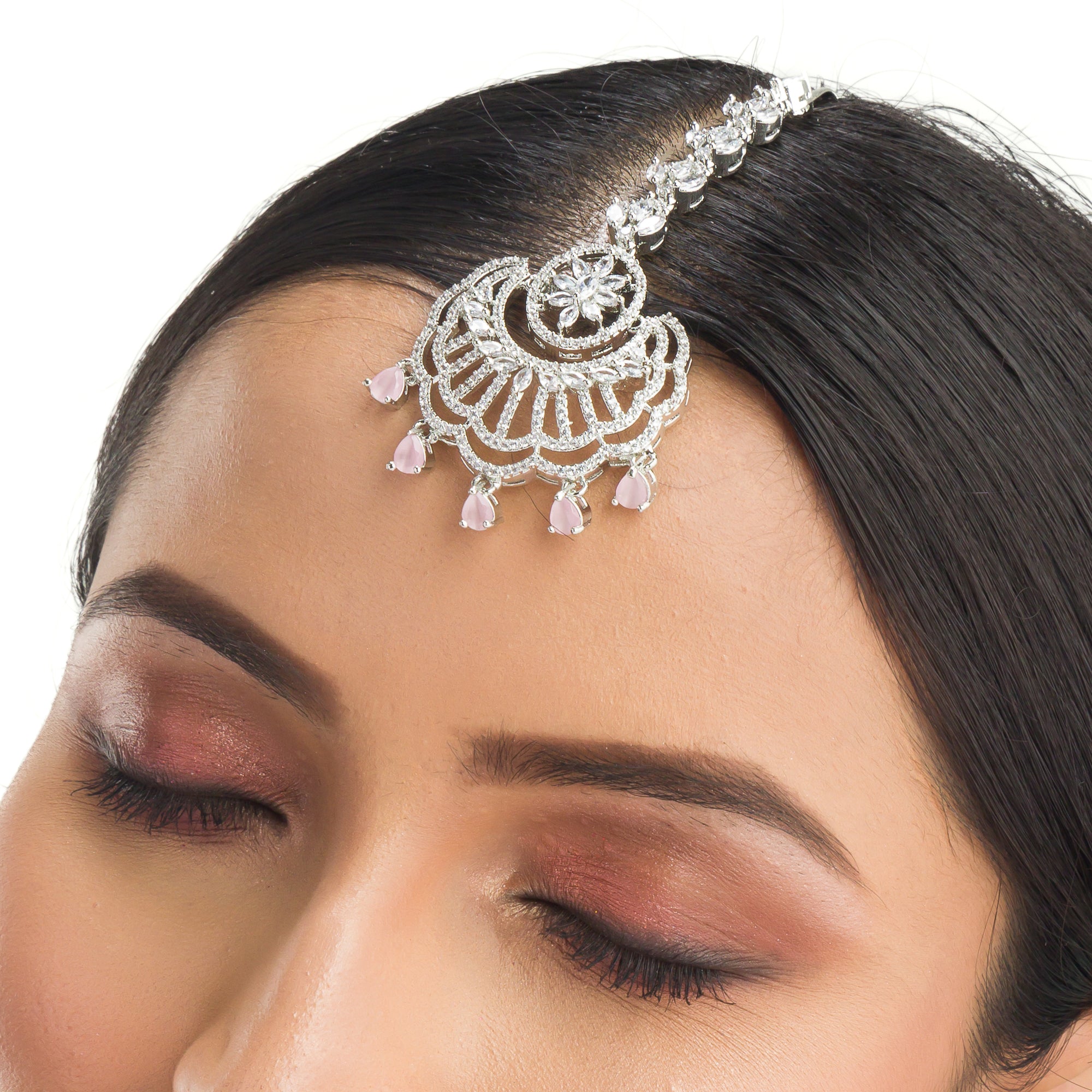 Pink zircon maang tika in silver, perfect for party wear, adding a soft, elegant pop of color to your look
