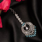 Aqua blue zircon maang tika in silver, perfect for party wear, adding a vibrant and elegant accent

