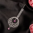 Pink zircon maang tika in silver, perfect for party wear, adding a chic touch of color and elegance
