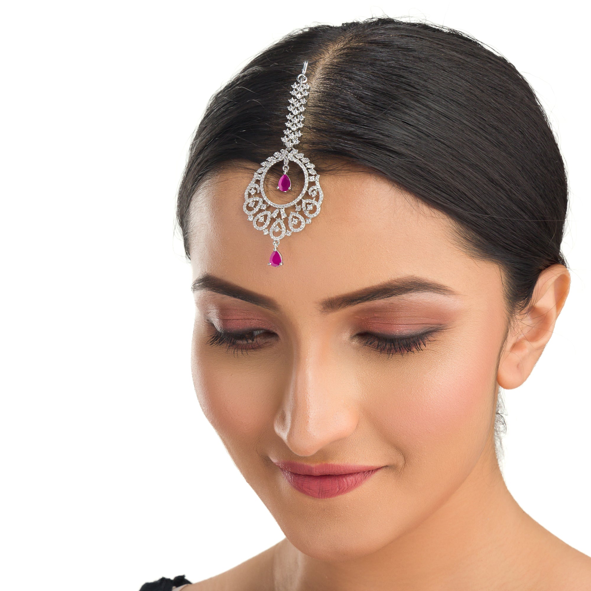 Pink zircon maang tika in silver, perfect for party wear, adding a chic touch of color and elegance
