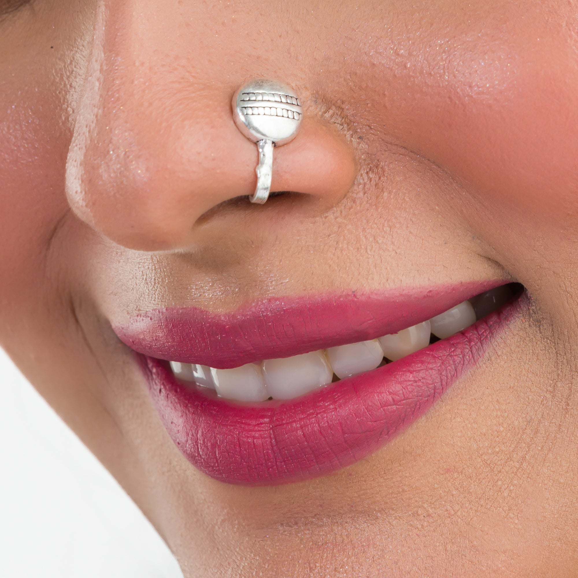 Small oxidized nose pin in silver, perfect for festival wear, adding a delicate vintage touch.
