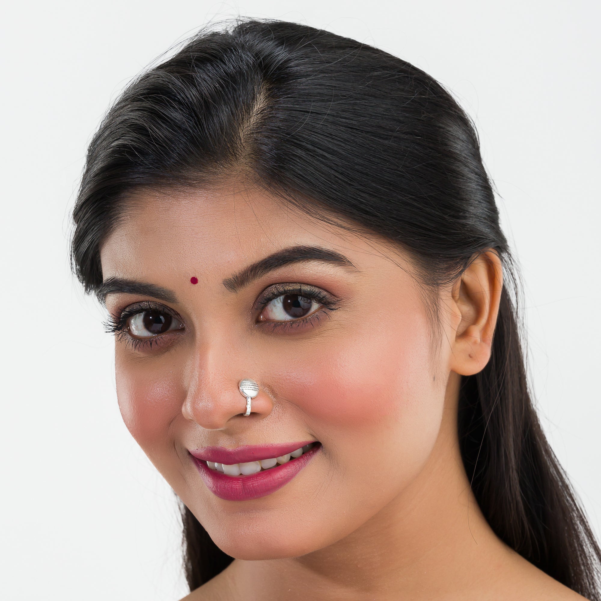 Small oxidized nose pin in silver, perfect for festival wear, adding a delicate vintage touch.
