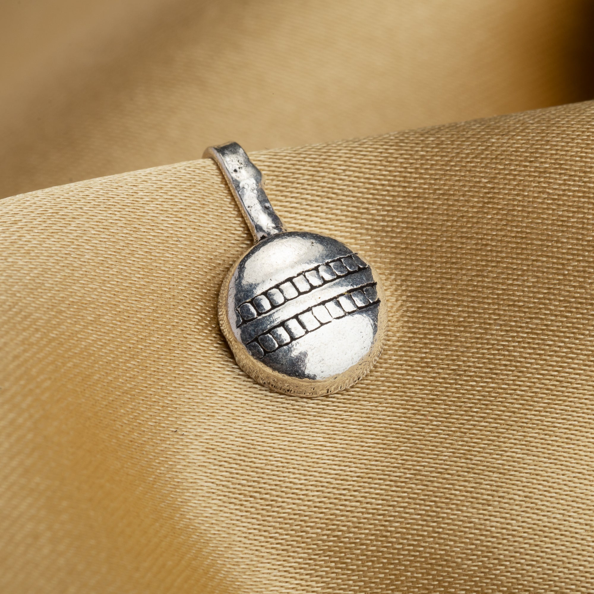 Small oxidized nose pin in silver, perfect for festival wear, adding a delicate vintage touch.
