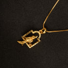"Charming gold-tone pendant with a bird in a nest, perfect for casual wear, with a warm, elegant finish."
