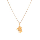 "Gold-tone pendant featuring three flowers, perfect for casual wear, offering a charming, delicate look."
