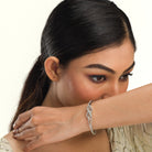 "Elegant zircon infinity bracelet, perfect for party wear, offering a timeless and chic style."
