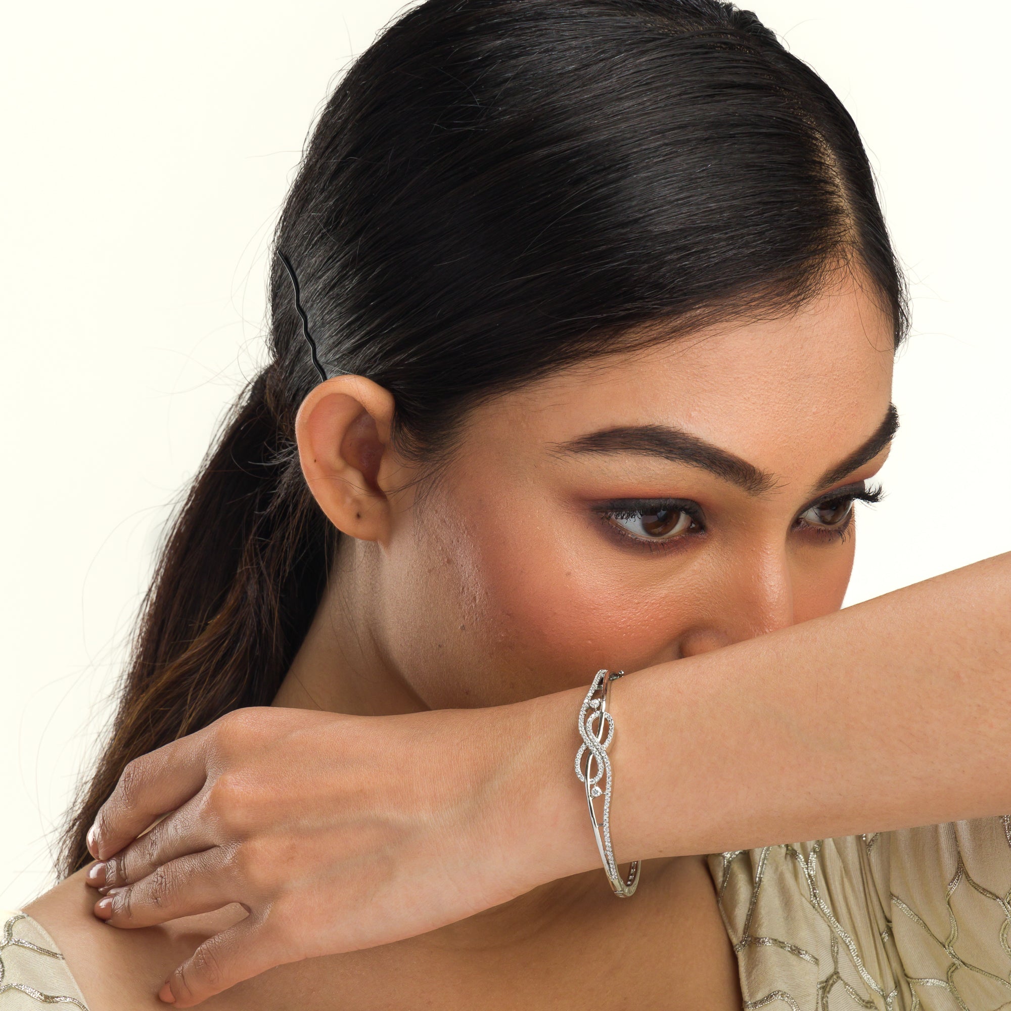 "Elegant zircon infinity bracelet, perfect for party wear, offering a timeless and chic style."
