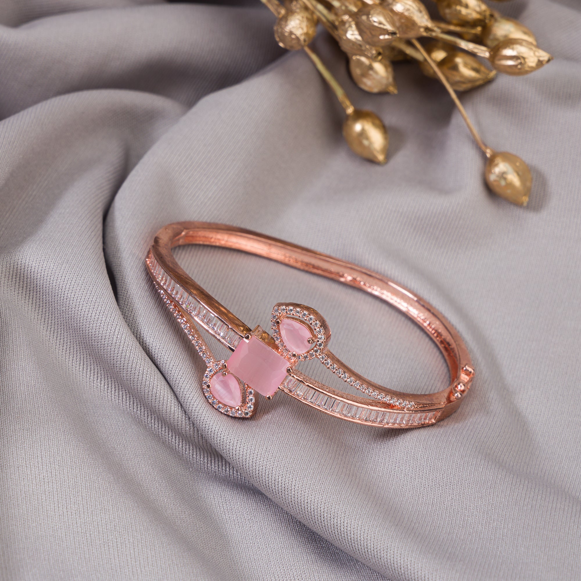Stunning pink zircon bracelet in rosegold, perfect for party wear, offering a vibrant, chic look."
