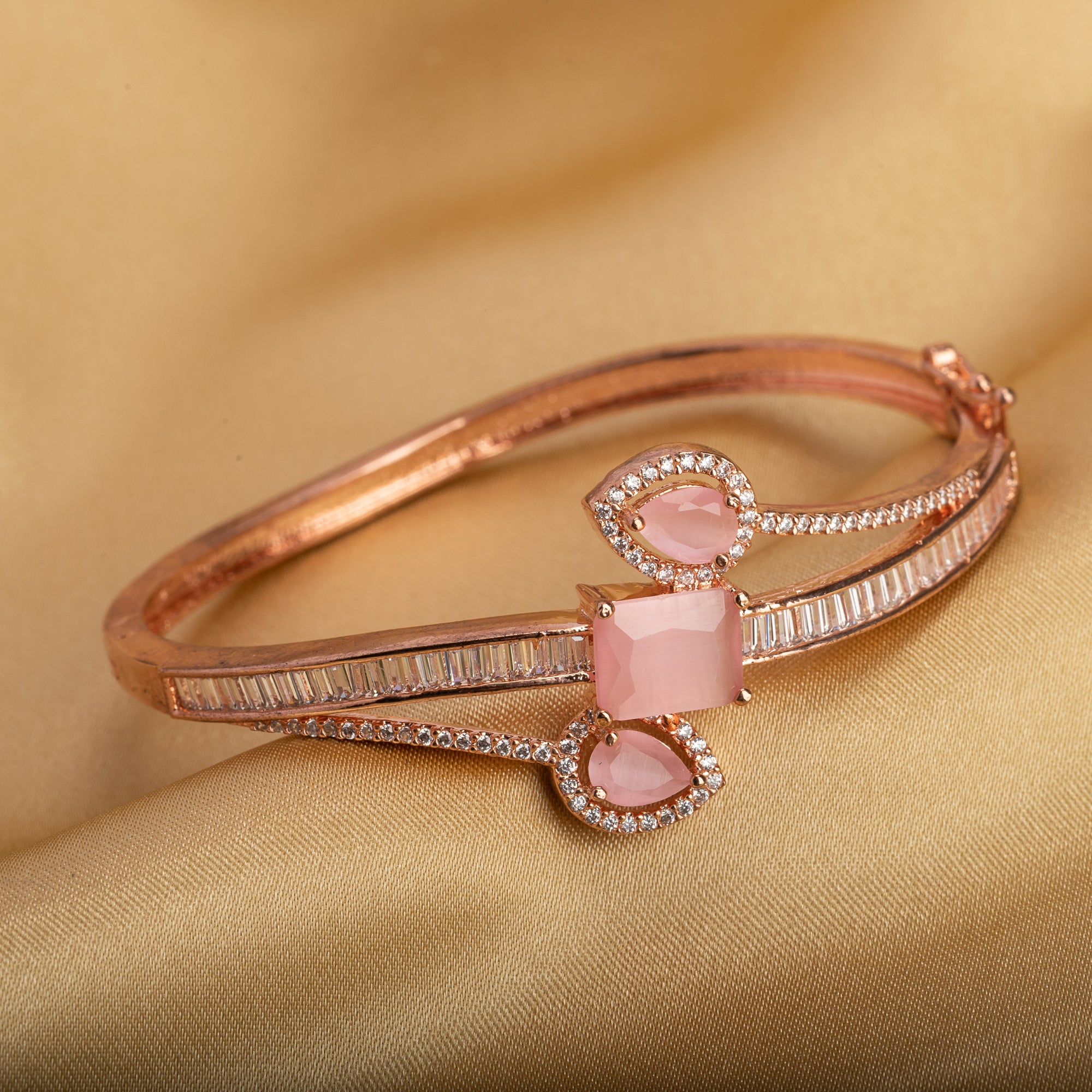Stunning pink zircon bracelet in rosegold, perfect for party wear, offering a vibrant, chic look."
