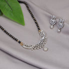 Elegant zircon mangalsutra in black and gold, blending traditional elegance with dazzling sparkle."
