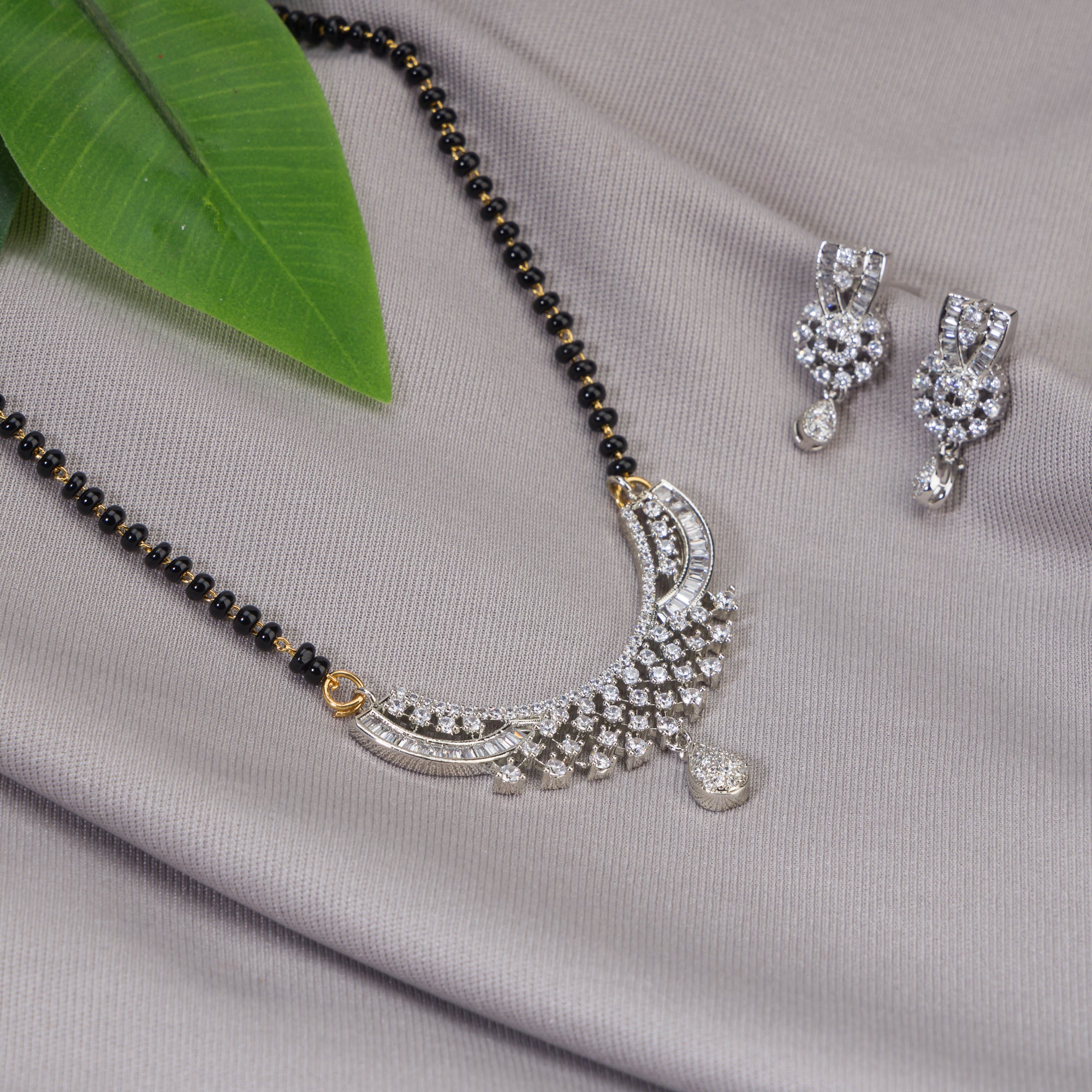 Elegant zircon mangalsutra in black and gold, blending traditional elegance with dazzling sparkle."
