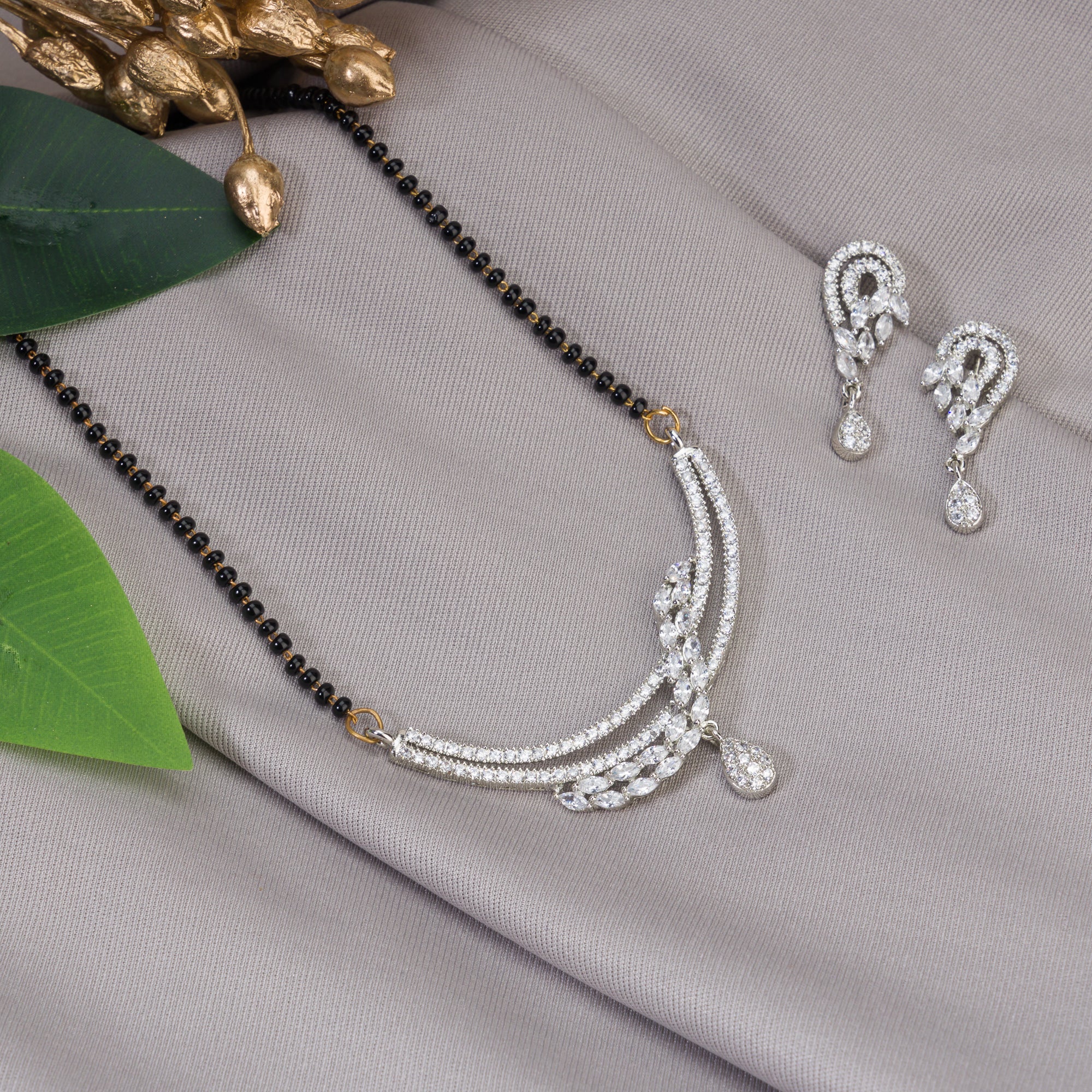 "Zircon mangalsutra in black and silver, blending traditional charm with radiant modern sparkle."
