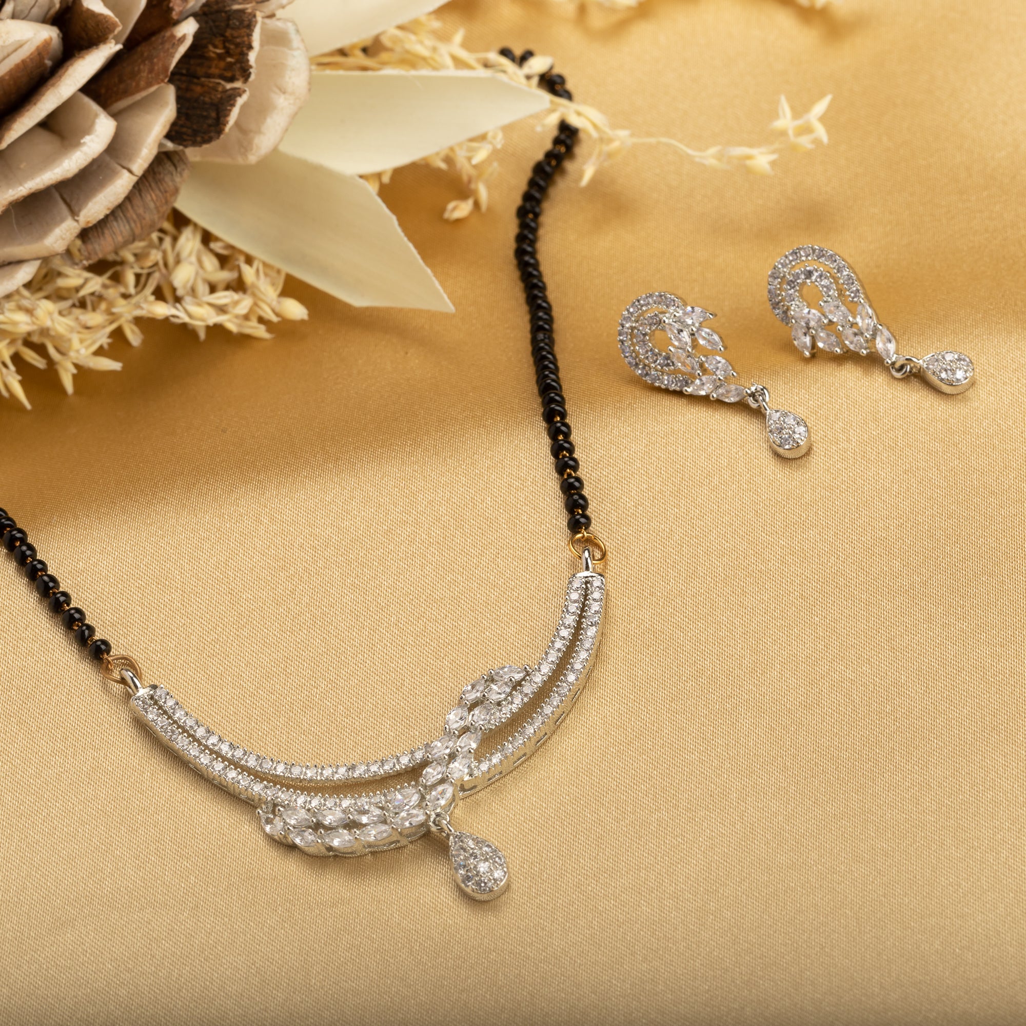 "Zircon mangalsutra in black and silver, blending traditional charm with radiant modern sparkle."
