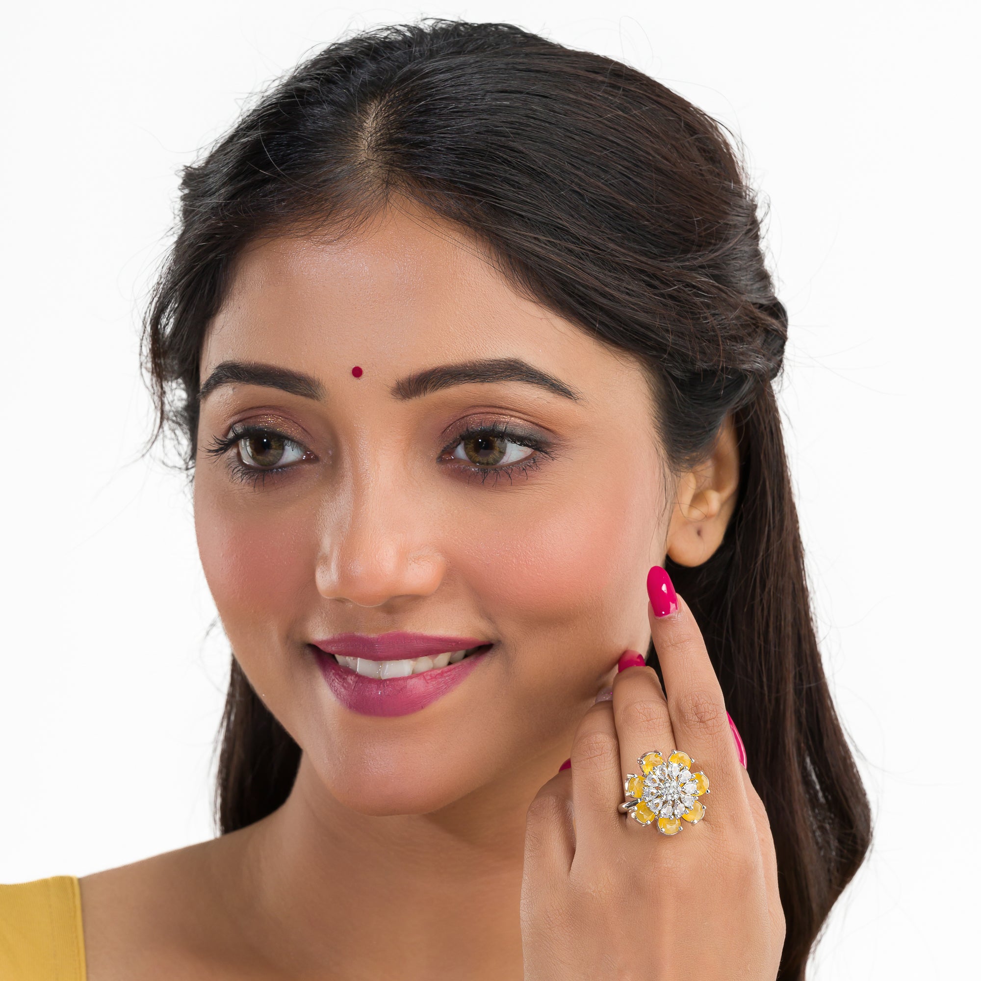"Yellow zircon finger ring in silver, offering vibrant, sunny brilliance and golden charm for party wear."
