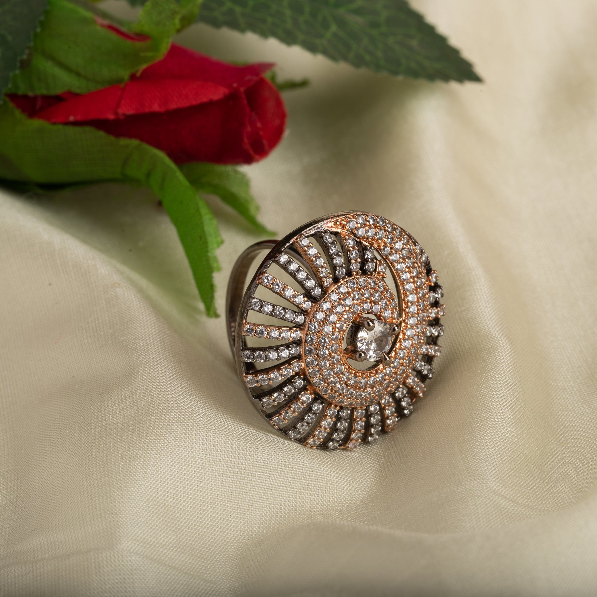 "Rose gold zircon ring with black accents blends elegance and dramatic flair for party wear."
