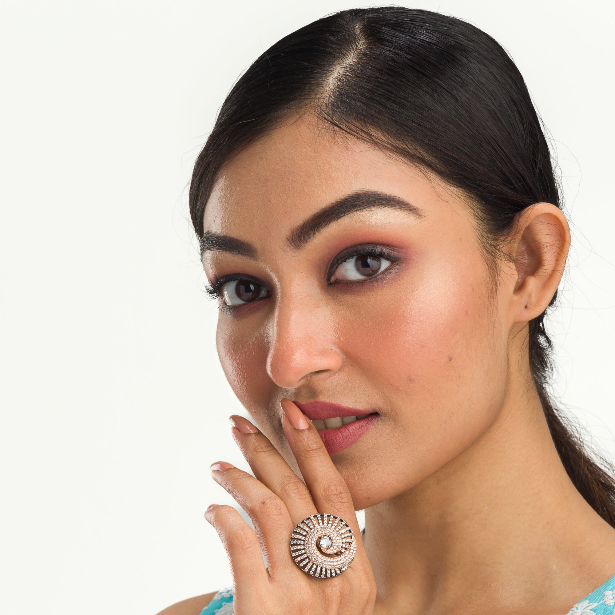 "Rose gold zircon ring with black accents blends elegance and dramatic flair for party wear."
