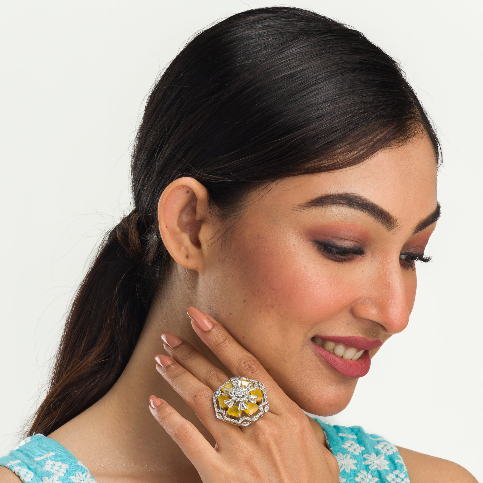 "Yellow zircon finger ring in silver radiates vibrant, eye-catching brilliance for party wear.
