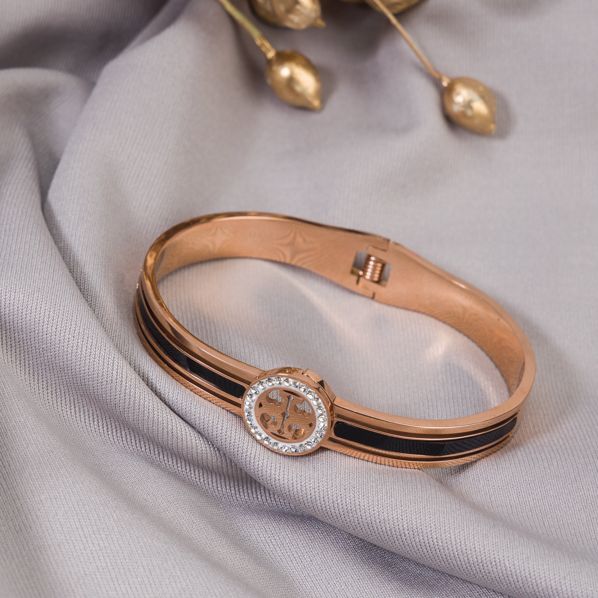 "Zircon bracelet with rose gold polish offers a sophisticated blend of sparkle and warmth for casual wear."
