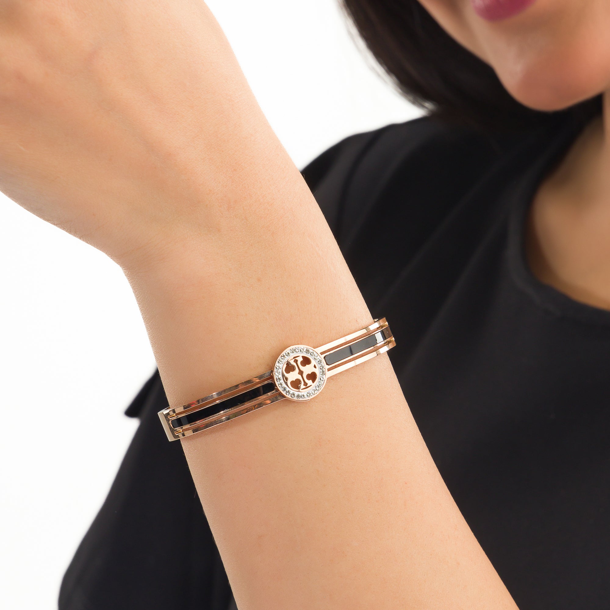 "Zircon bracelet with rose gold polish offers a sophisticated blend of sparkle and warmth for casual wear."
