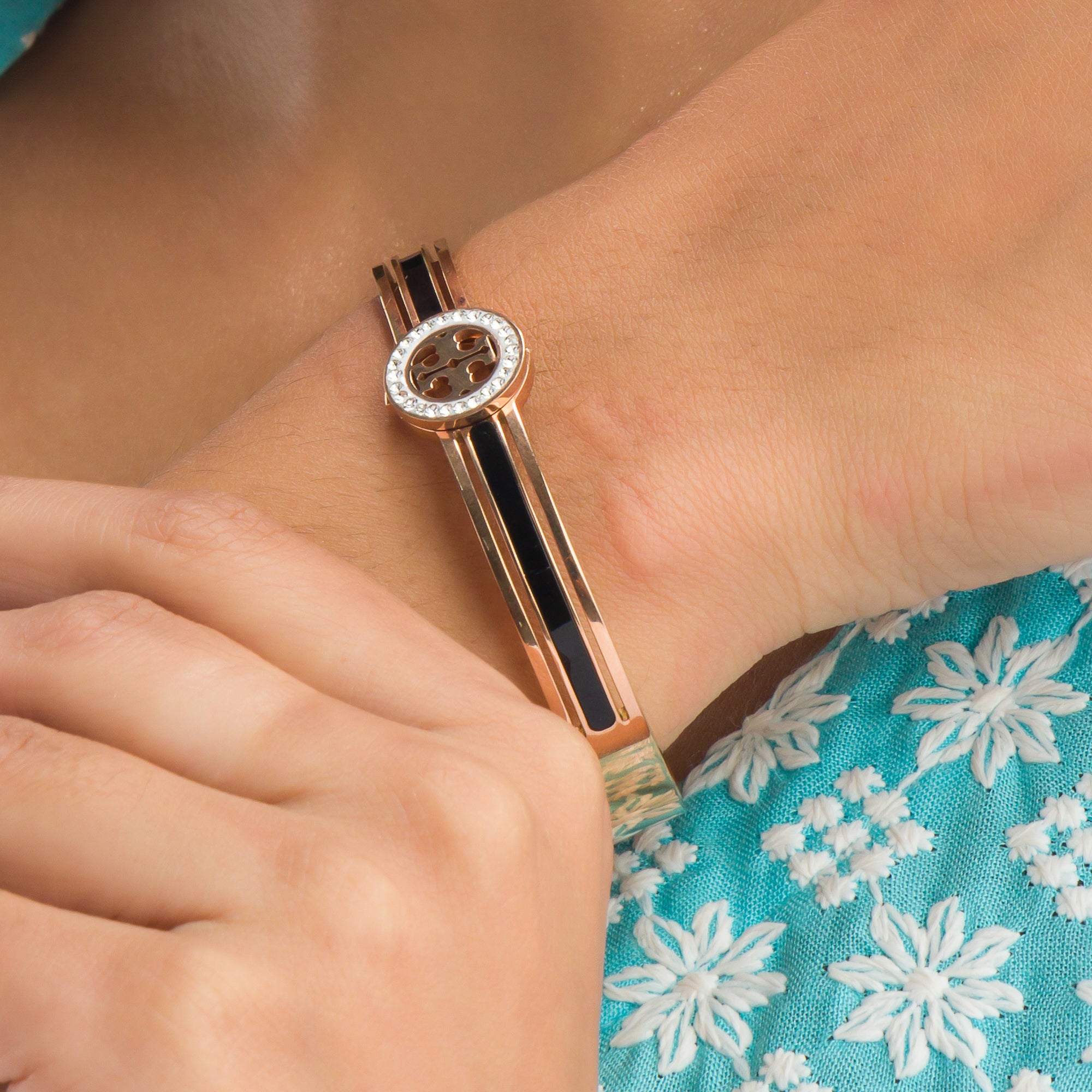 "Zircon bracelet with rose gold polish offers a sophisticated blend of sparkle and warmth for casual wear."
