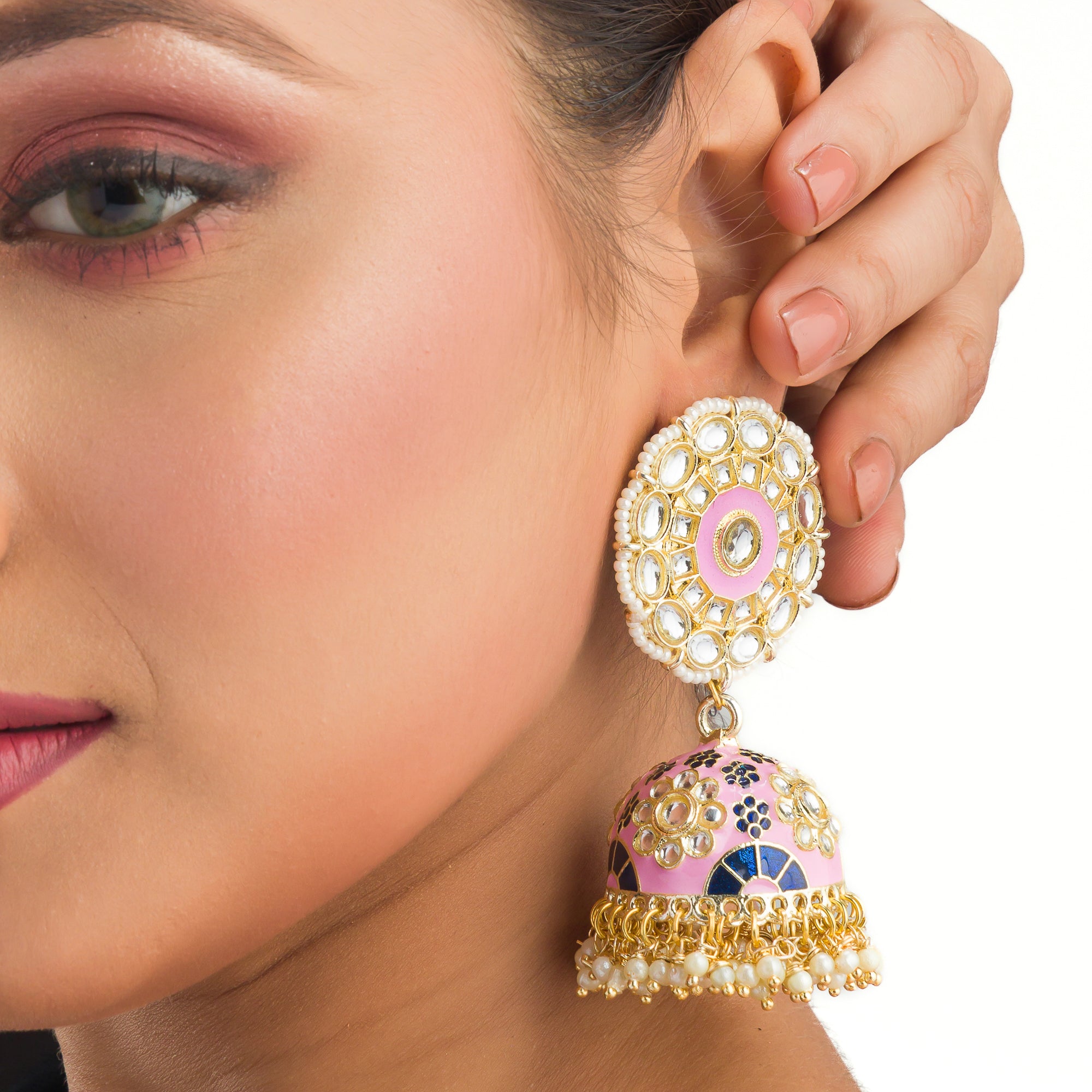 "Orchid minakari jhumka earrings in gold tone showcase intricate, vibrant designs with timeless elegance for festivals."
