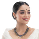 "Zircon stud earrings in silver offer intricate detailing and radiant sparkle for a traditional, elegant party wear look."
