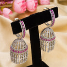 "Pink zircon big jhumka features vibrant design with intricate detailing for a bold look."
