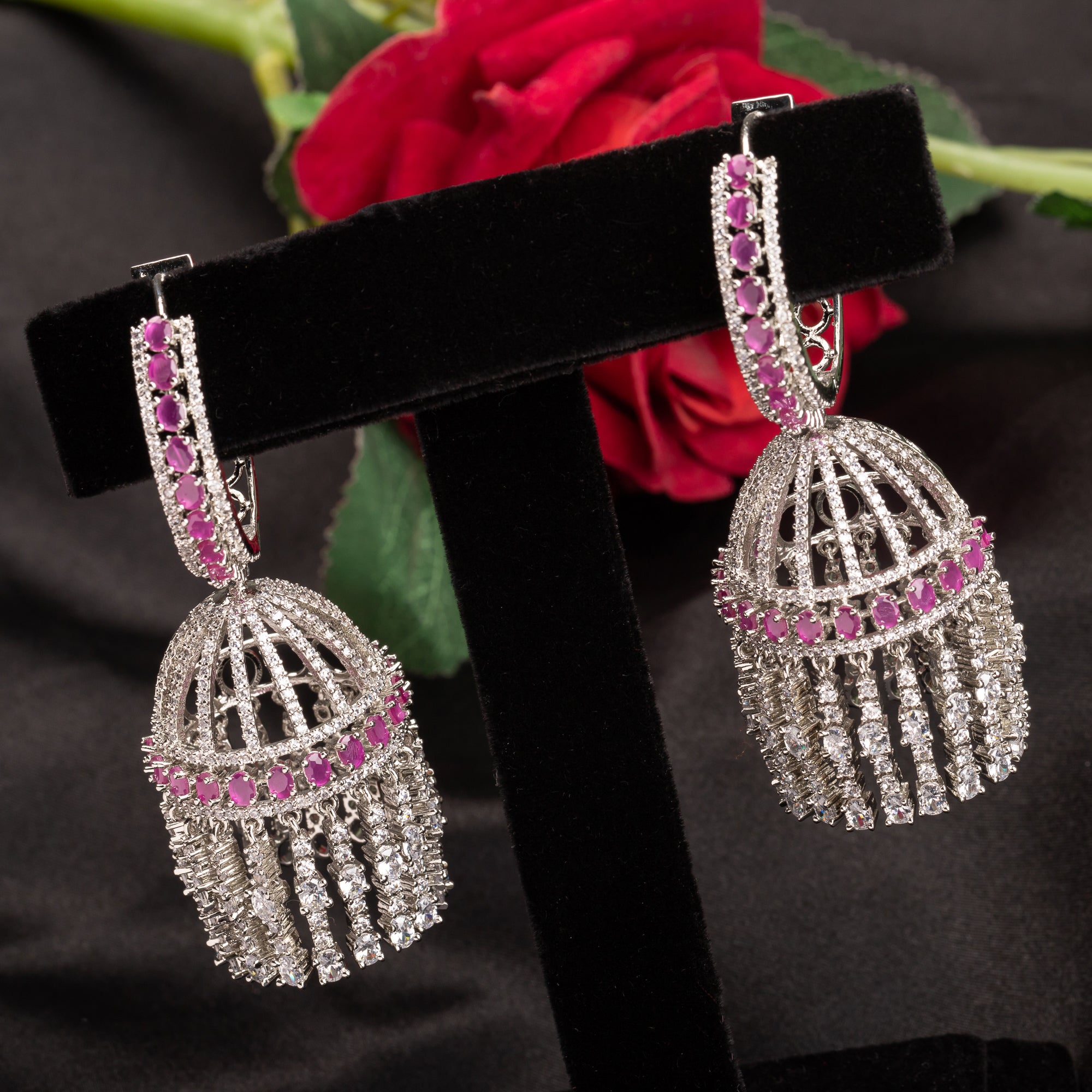 "Pink zircon big jhumka features vibrant design with intricate detailing for a bold look."
