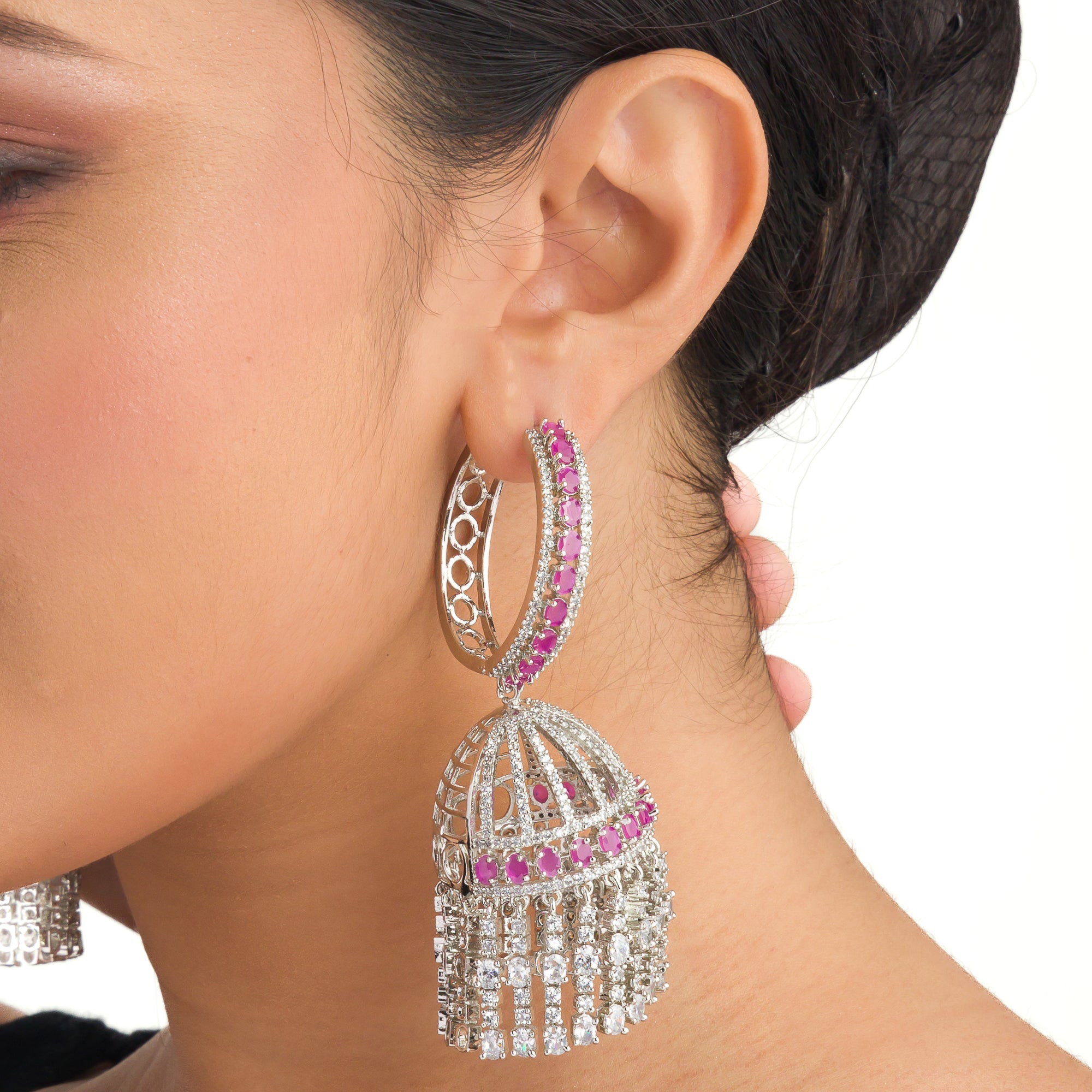 "Pink zircon big jhumka features vibrant design with intricate detailing for a bold look."
