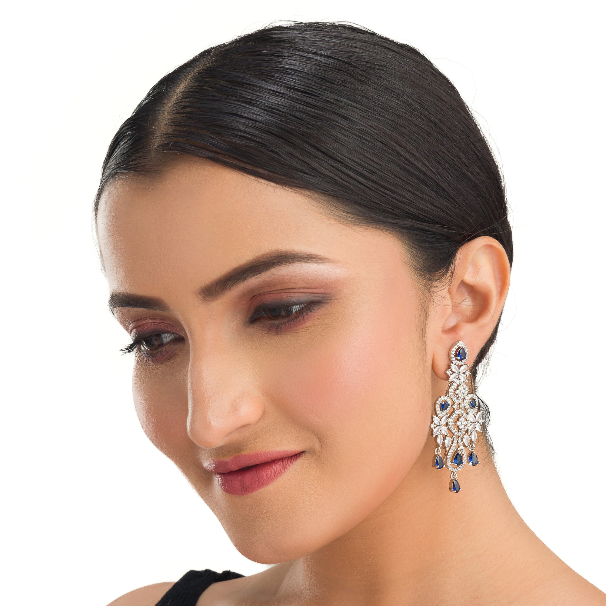 "Light blue zircon earrings offer delicate sparkle with a hint of serene elegance."
