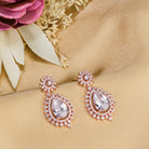 "Rose gold zircon earrings add elegance and sparkle to any look with timeless shine."
