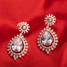 "Rose gold zircon earrings add elegance and sparkle to any look with timeless shine."
