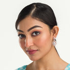 "Rose gold zircon earrings add elegance and sparkle to any look with timeless shine."
