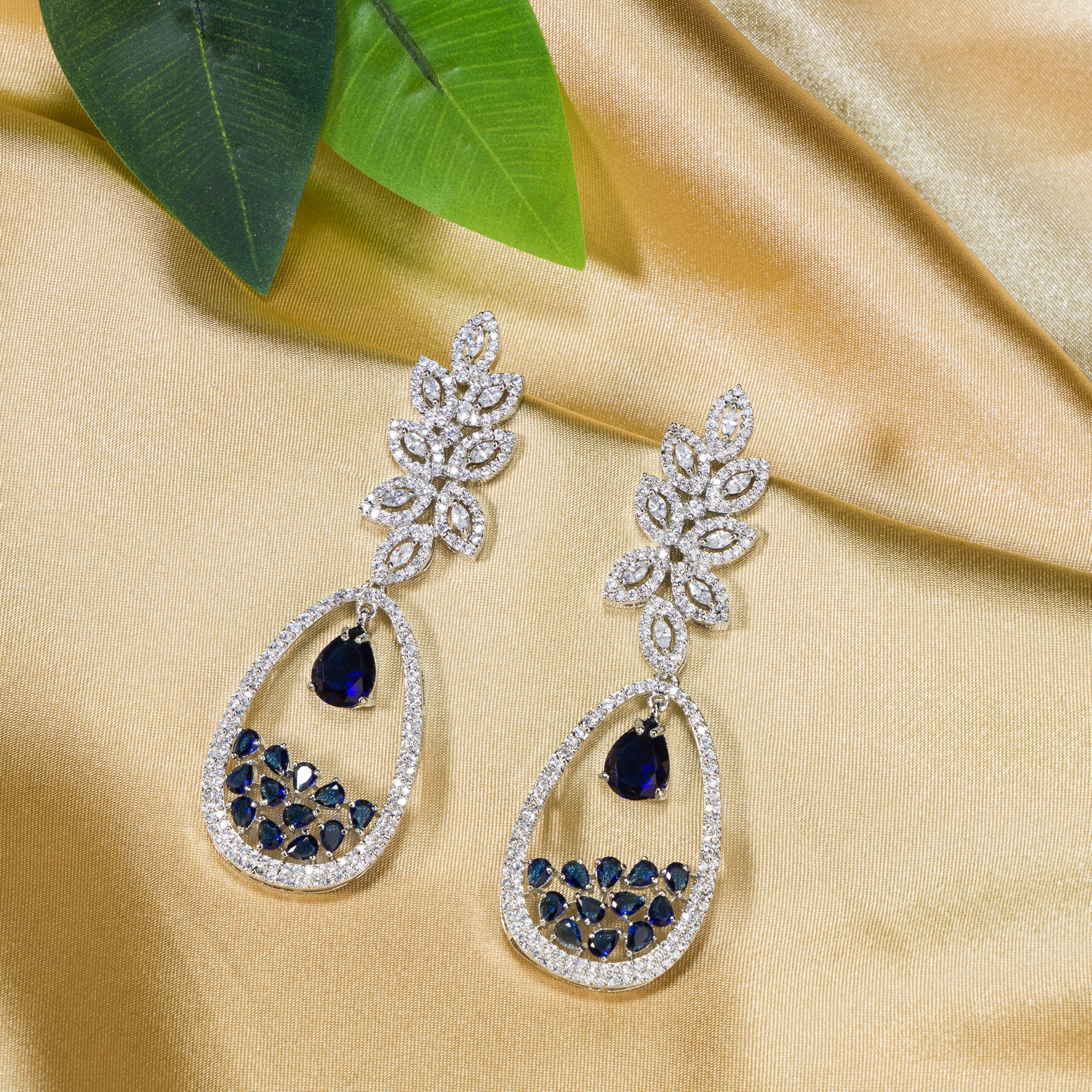 1. "Light blue zircon earrings offer a fresh, delicate sparkle with serene elegance."
