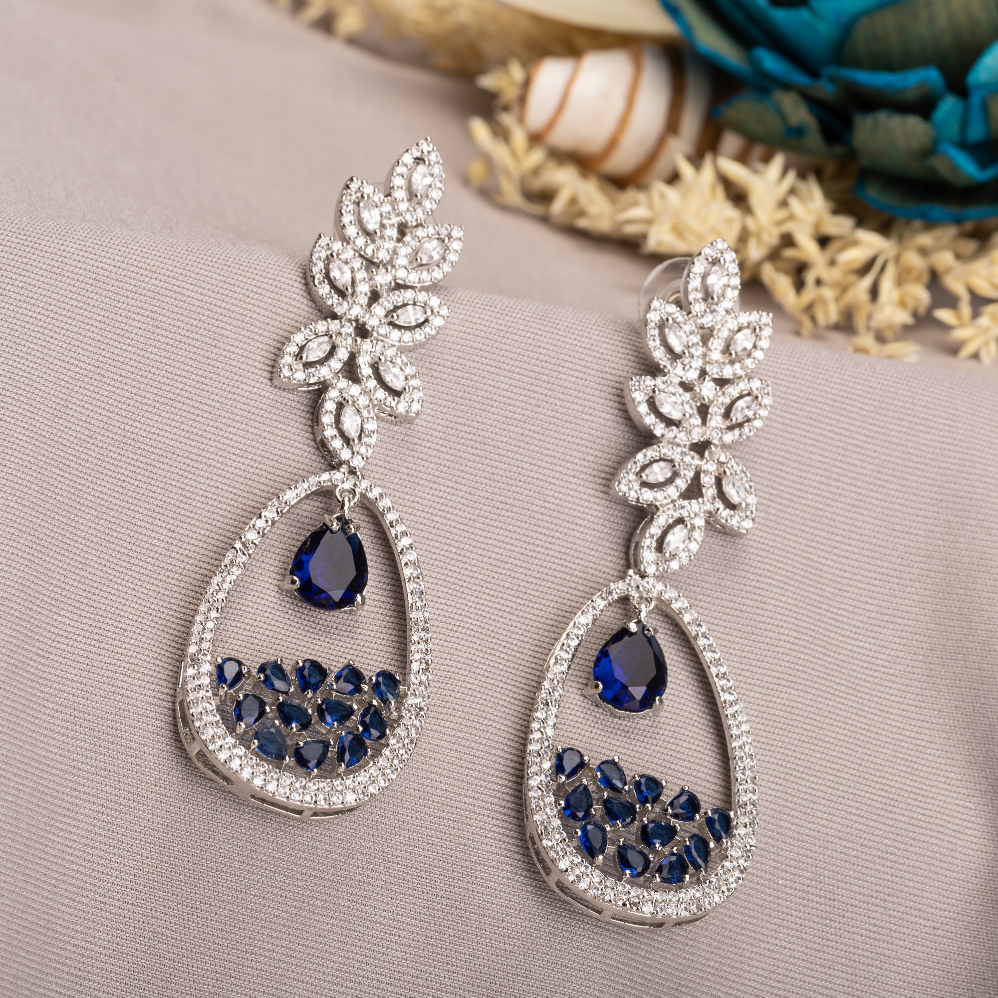 1. "Light blue zircon earrings offer a fresh, delicate sparkle with serene elegance."
