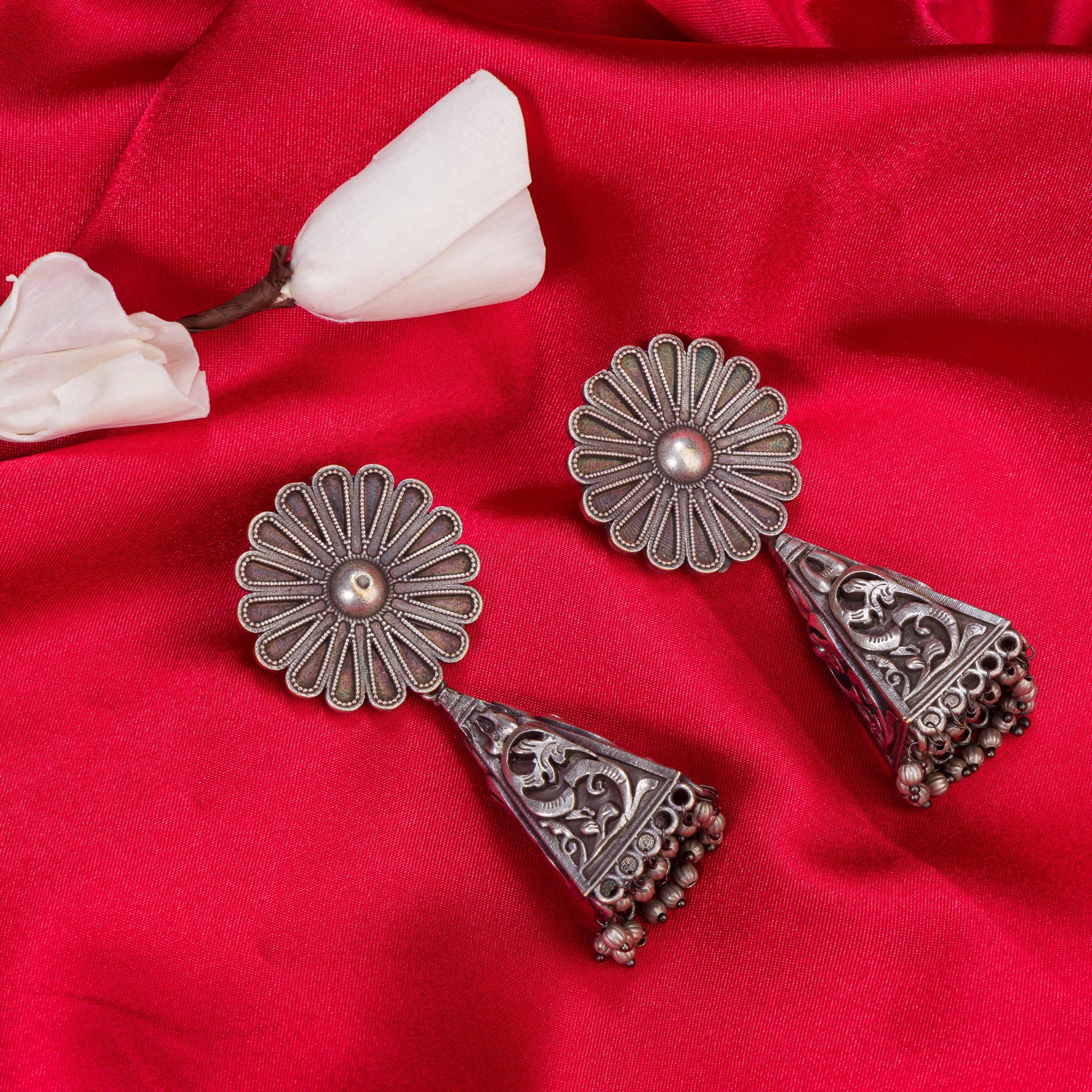 "Trendy oxidized earrings with a sleek, modern edge to elevate any outfit."
