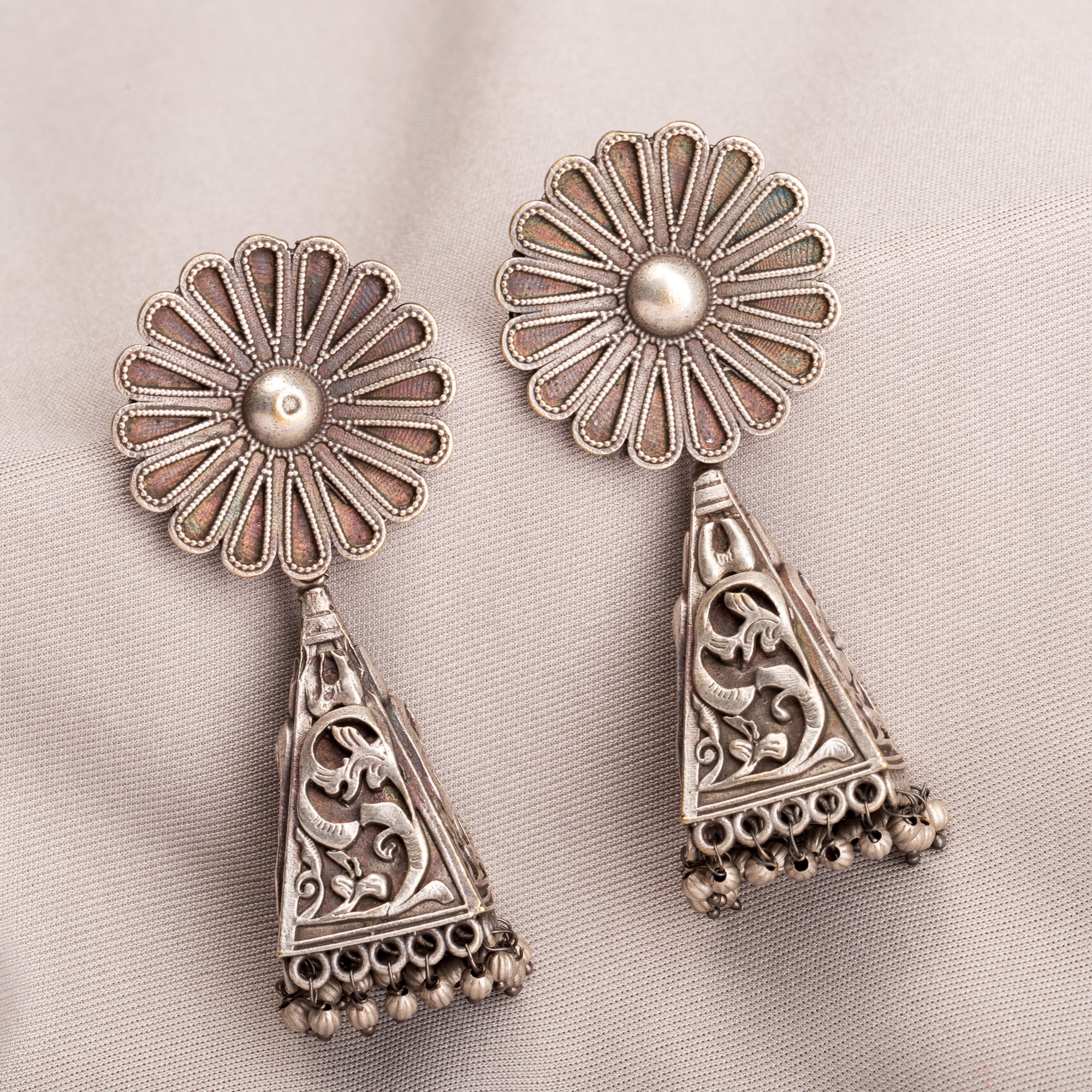 "Trendy oxidized earrings with a sleek, modern edge to elevate any outfit."
