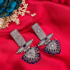 "Oxidized earrings with blue beads offer a unique vintage touch and a pop of color."
