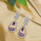 "Dark blue zircon dangler earrings offer a captivating, deep sparkle for a bold look."
